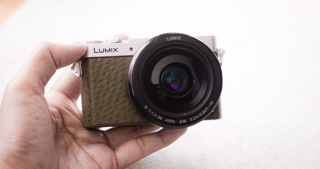 Camera in hand in natural lighting.