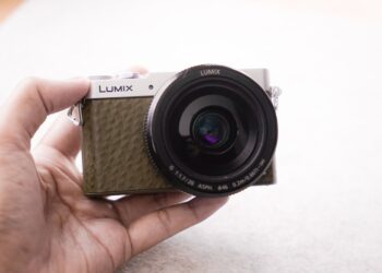 Camera in hand in natural lighting.