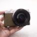 Camera in hand in natural lighting.
