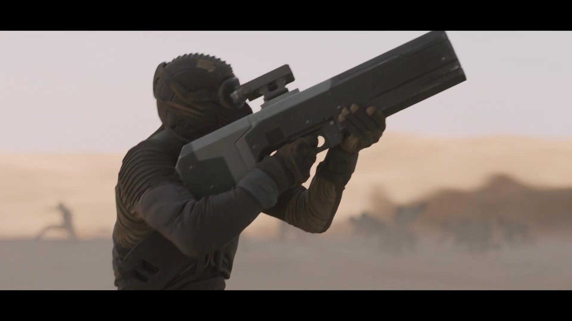 Een Fremen-strijder met een wapen in de woestijn van Arrakis, still uit de laatste trailer van Dune: Part Three